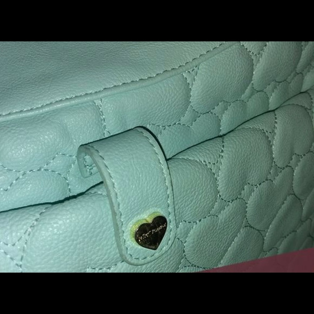 Betsey Johnson Diaper Bag. Barley used. Front pocket zips to a changing pad.